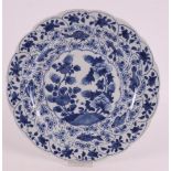 A contoured blue and white porcelain dish, China, Kangxi, around 1700. Blue underglaze of peonies on