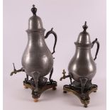 A white pewter pear-shaped tap jug, late 19th century. Resting on a copper/brass triangular brazier,