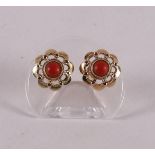 A pair of 14 carat 585/1000 gold ear studs with cabochon cut red corals.