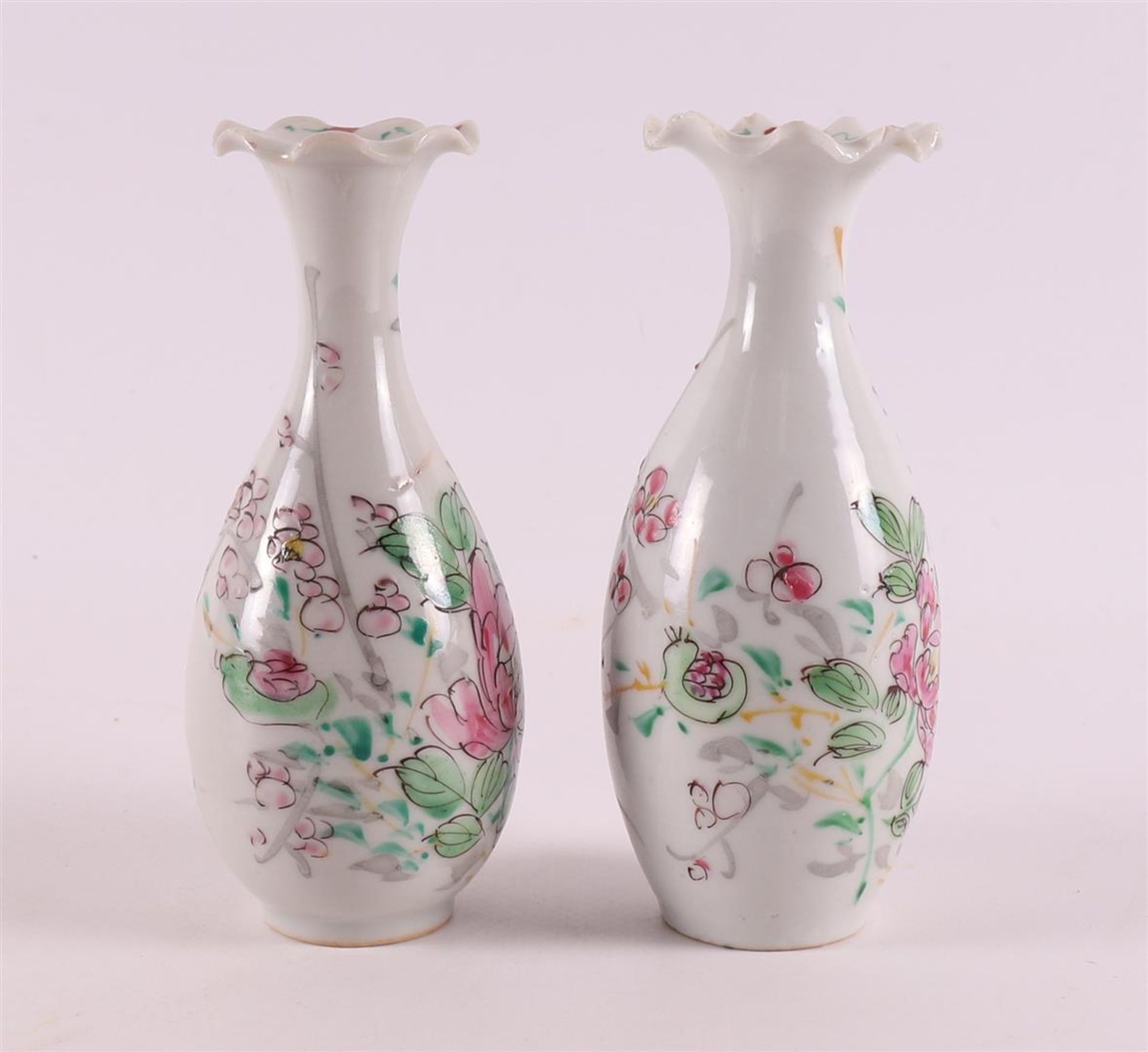 A pair of baluster-shaped vases with a contoured neck, Japan, 19th century. Polychrome floral decor, - Image 4 of 10