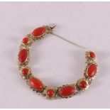 A 14 kt 585/1000 yellow gold bracelet, set with cabochon cut precious corals, gross weight 26.6