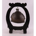 A bronze gong in wooden stand, China, circa 1900, h 48 cm.