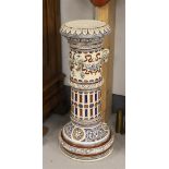 A cylindrical stoneware pedestal, Germany, early 20th century. Decor of ram heads, garlands and