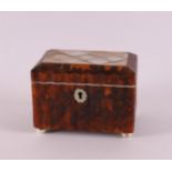 A rectangular organ-bent tortoiseshell tea box, 19th century. Lid with mother of pearl,