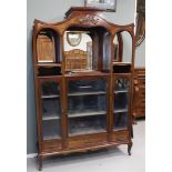 An Art Nouveau coffee cabinet, Netherlands, Amsterdam, early 20th century. Walnut, double curved