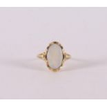 A 14 kt 585/1000 yellow gold ring, set with oval cabochon cut opal, gross weight 2.3 grams, ring