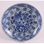 A blue and white porcelain deep dish, China, Kangxi, around 1700. Blue underglaze decoration of