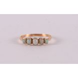 A 14 kt 585/1000 gold ring, set with five oval cabochon cut opals, gross weight 2.0 grams, ring size