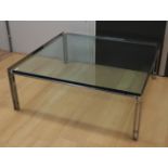 A square chrome metal coffee table with clear glass top, 1960s/1970s, h36 x l92 x w92 cm.