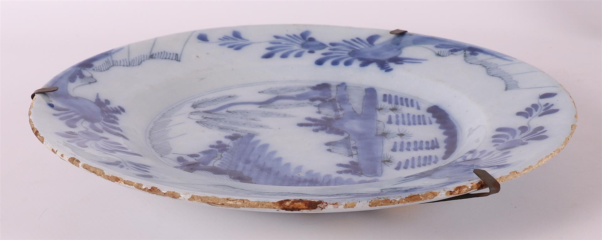 Two various Delft earthenware plates, 18th century. a.o. 'Wanli' decor and 'Willow', Ø 21.5 and 23 - Image 4 of 8