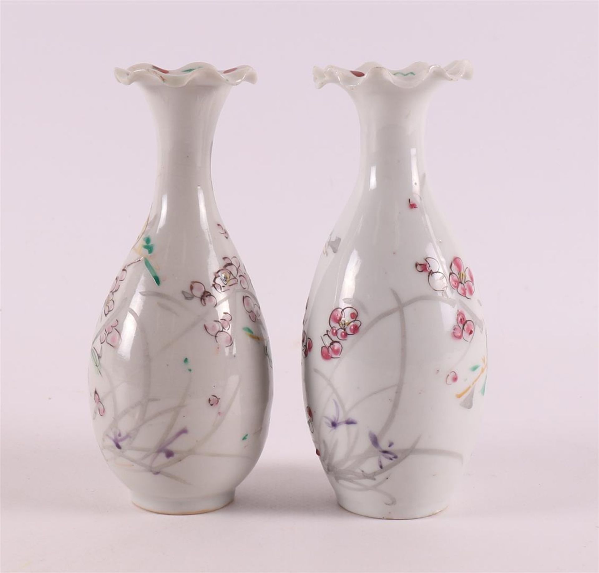 A pair of baluster-shaped vases with a contoured neck, Japan, 19th century. Polychrome floral decor, - Image 3 of 10