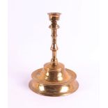 A brass/bronze button candlestick, Southern Netherlands, 15th century. The conical candle mouth with