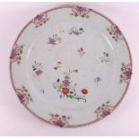 A porcelain famille rose dish, China, Qianlong 18th C. Polychrome floral decor, Ø 47 cm (2