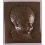 A brown patinated bronze bas relief of a baby, signed with monogram 'JS' (Jan Sluyters?), h 23 x w