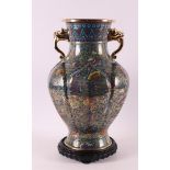 A baluster-shaped bronze cloissoné vase with gilt lion's heads for ears, China, 1st half 20th