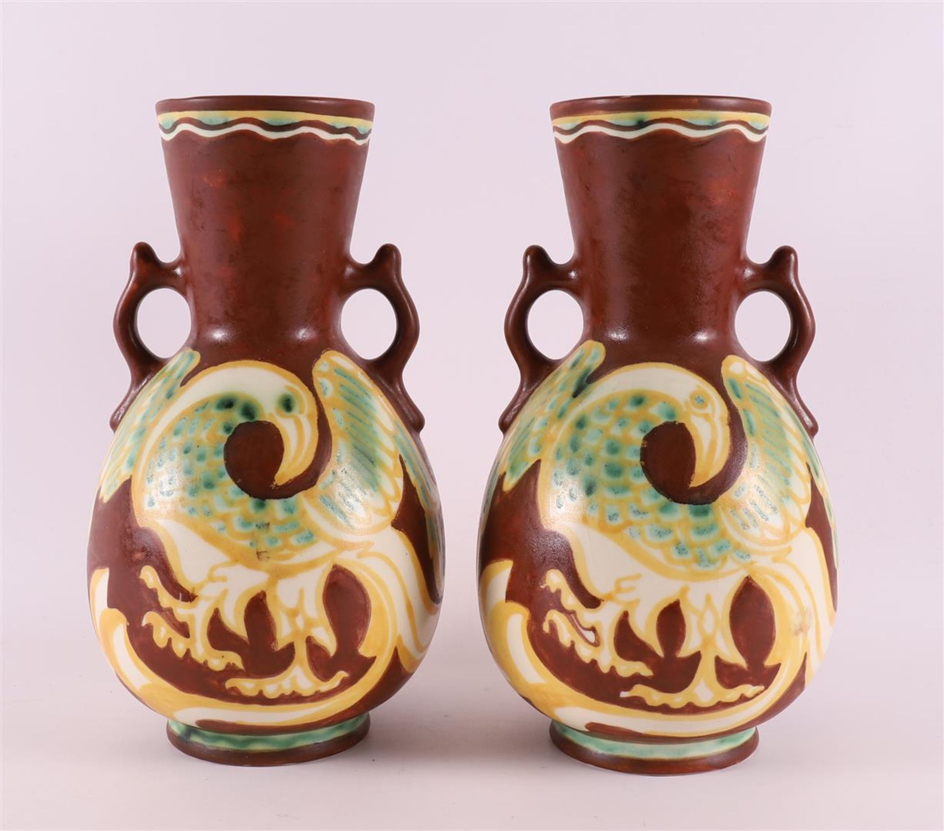 A pair of earthenware vases with handles with polychrome decor of griffins, ca. 1930. Design: Lion