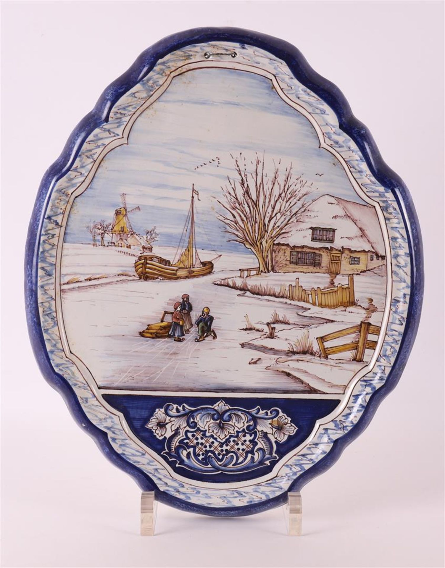 A polychrome earthenware plaque, Harlingen, 1st half of the 20th century. Decor of a Dutch winter