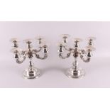 A set of 1st grade 925/1000 silver 5-light candlesticks decorated with roses. Weighted base, gross