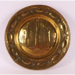 A brass baptismal dish with embossed decor of Adam and Eve with the forbidden fruit, 18th century, Ø