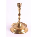 A brass button candlestick, Southern Netherlands, 15th century. The conical candle mouth with two