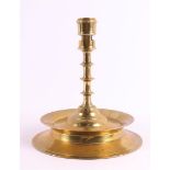 A brass/bronze button candlestick, Southern Netherlands, 16th century. The conical candle mouth with