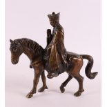 A brown patinated bronze dignitary on horseback, China, 20th century, h 18 cm.