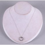 A 10 kt BWG necklace and pendant with 16 diamonds.