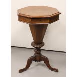 A conical mahogany sewing table on a volute tripod, 19th century, h 72 cm.