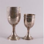 Two silver prize cups, dated a.o. 1934, total 285 grams, h 14 and 18 cm, tot. 2x.