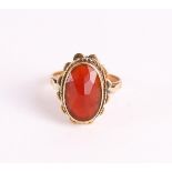 A 14 kt 585/1000 yellow gold ring, set with oval faceted carnelian, gross weight 4.5 grams, ring