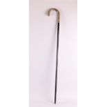 An ebonised wooden walking stick with a second grade 835/1000 silver handle, 1st half of the 20th