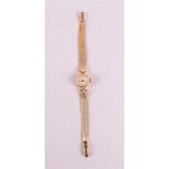 A Dauphine women's wristwatch in 14 kt 585/1000 yellow gold case and strap, gross weight 17.7 grams,