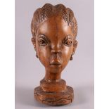Ethnography. A tropical wooden bust of a woman, Africa, Ivory Coast or surroundings, 20th century, h