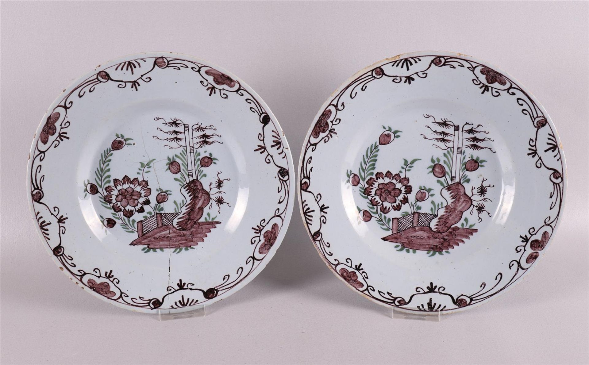 Two Delft earthenware plates, Holland, 18th century. Manganese and green Chinoise decor, Ø 22.5