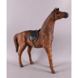 A brown leather model of a horse, 20th century, h 50 cm.