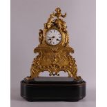 A gilded mantel clock, France, Louis Philippe, mid 19th century. Casing crowned with a young woman