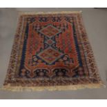 An Oriental carpet/praying mat, 20th century, l 142 x w 110 cm.