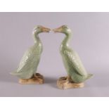 A pair of green glazed bottle neck ducks, China, marked on the underside, (wing damage) h 20 cm,