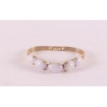 A 14 kt 585/1000 yellow gold bracelet, set with five cabochon cut milk opals, gross weight 25.6