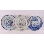 A lot of three porcelain plates, China 18th century. a.o. blue underglaze decoration of cuckoo