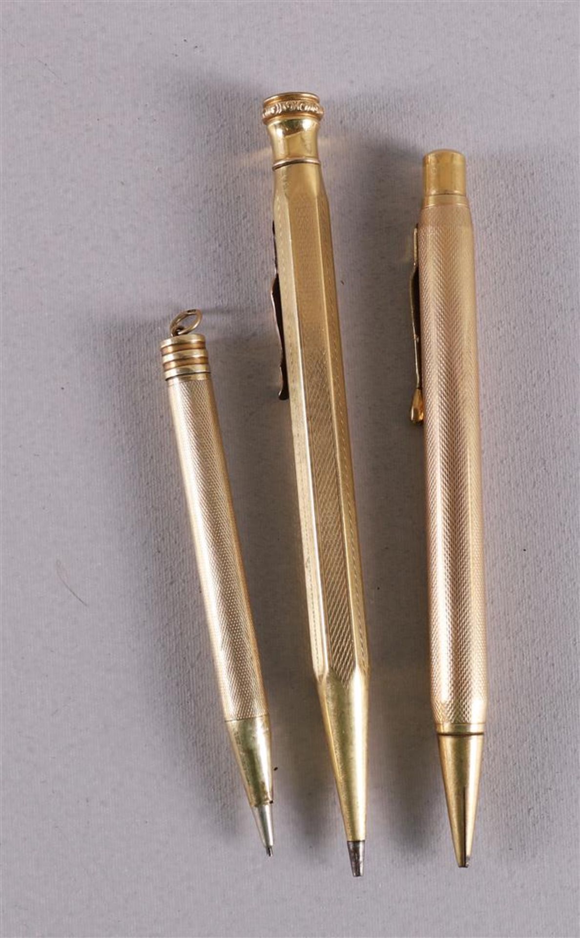 Two various rolled gold safety overlay fountain pens, United States, ca. 1920-1950. Hereby a ditto