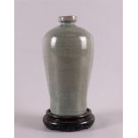A celadon glazed Meiping vase on wooden base, 20th century, h 22 cm.