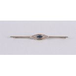 An 18 carat 750/1000 white gold Art Deco brooch set with oval cut blue sapphire, 1st half 20th