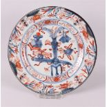 A Chinese Imari porcelain plate, China, Kangxi, around 1700. Blue/red, partly gold-heightened