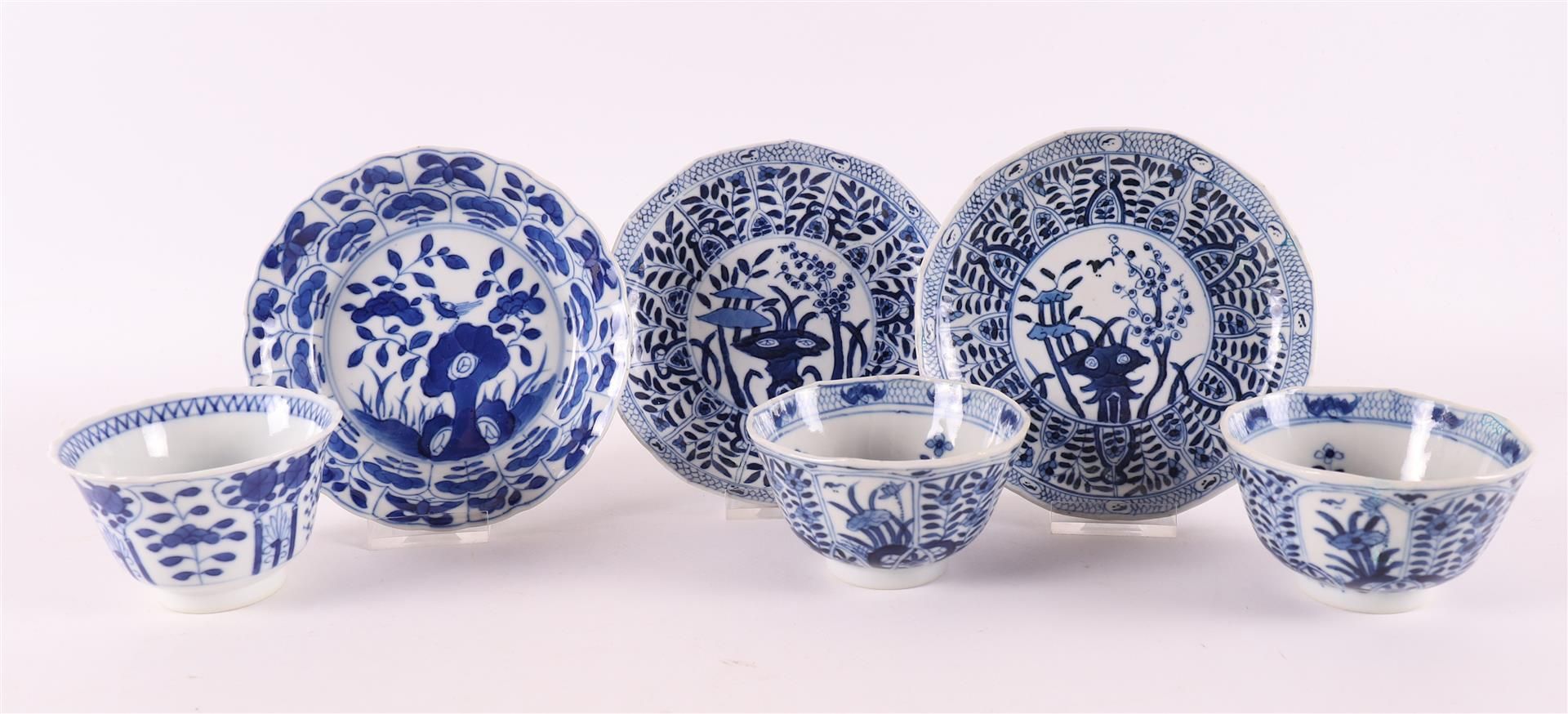 Three various blue/white porcelain cups and saucers, China, 1st half of the 19th century. Blue