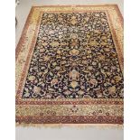 An Oriental carpet, red and blue ground with animal and floral motifs, signed, length 390 x w 300