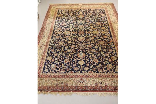 An Oriental carpet, red and blue ground with animal and floral motifs, signed, length 390 x w 300 - Image 1 of 7