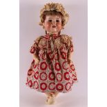 A limbed doll with a porcelain head, Germany, ca. 1930. Marked: Armand Marseille, no. 992, l58 cm.