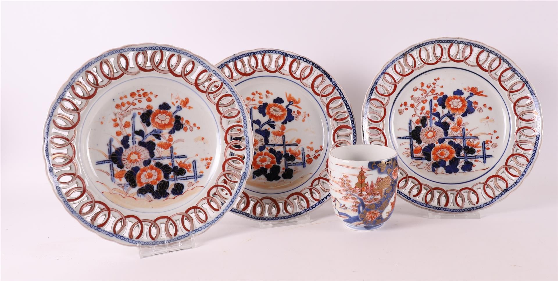 A series of three porcelain Imari plates with pierced lip, Japan, Meiji, late 19th century. Hereby a