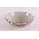 A porcelain bowl on a stand ring, China, Tongzhi, 1862-1874. Polychrome floral decor and
